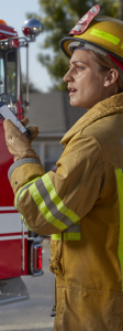 Firefighter looking at cell phone