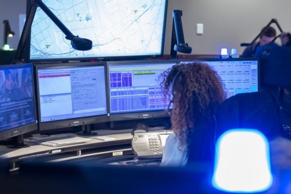 911 operator sitting at desk