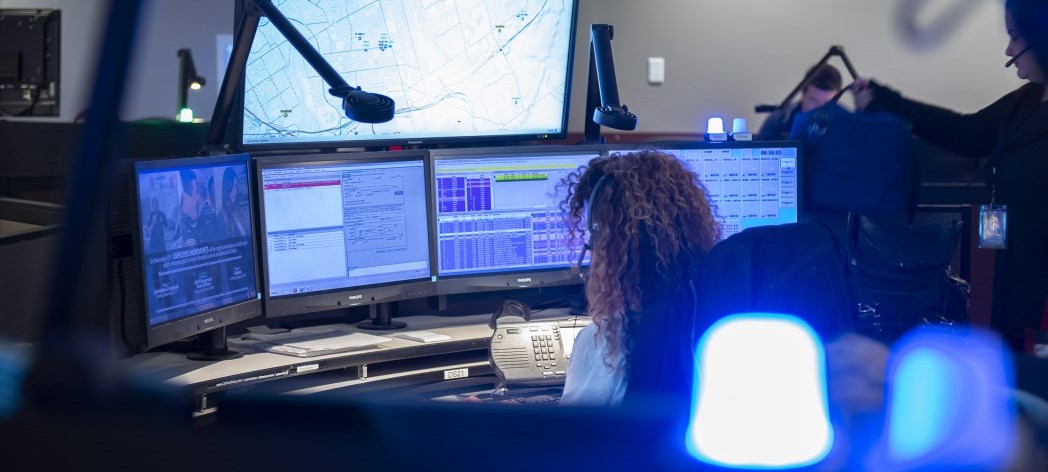 911 operator sitting at desk